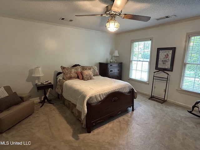 502 Frederick Dr, Cleveland, MS 38732 - bedroom featuring multiple windows, ornamental molding, light carpet, baseboards, and a textured ceiling