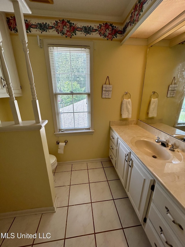 502 Frederick Dr, Cleveland, MS 38732 - bathroom with vanity, toilet, tile patterned floors, and baseboards