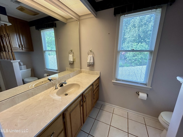 502 Frederick Dr, Cleveland, MS 38732 - half bath with toilet, tile patterned flooring, baseboards, and vanity