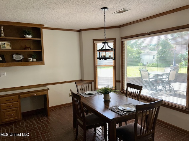 502 Frederick Dr, Cleveland, MS 38732 - dining room featuring baseboards, plenty of natural light, a textured ceiling, brick patterned floors, and ornamental molding