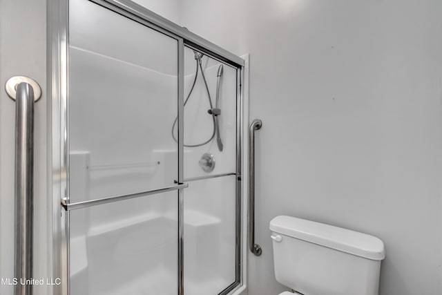603 Charmant Pl, Ridgeland, MS 39157 - bathroom featuring toilet and a shower with door