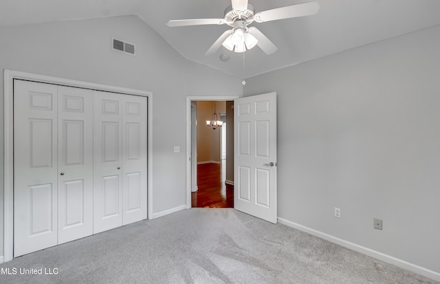 603 Charmant Pl, Ridgeland, MS 39157 - unfurnished bedroom featuring a chandelier, carpet flooring, vaulted ceiling, a closet, and ceiling fan