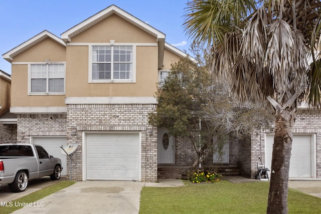 view of front of house with a garage and a front lawn