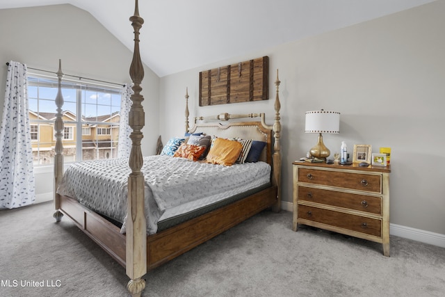 carpeted bedroom featuring vaulted ceiling