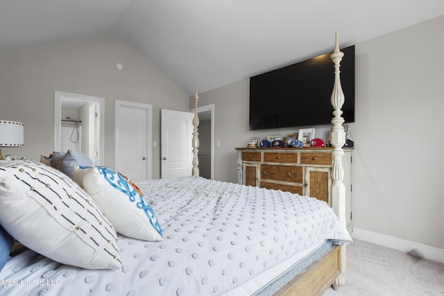 bedroom featuring lofted ceiling and carpet flooring