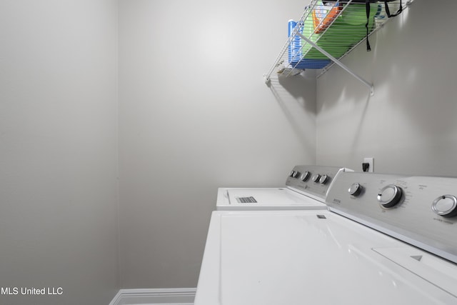 laundry room with washer and clothes dryer