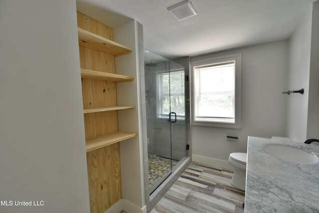 3490 Sherrod Rd, Nesbit, MS 38651 - full bathroom featuring a shower stall, wood finished floors, toilet, baseboards, and vanity