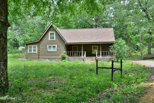 3490 Sherrod Rd, Nesbit, MS 38651 - log home featuring log siding, covered porch, and a shingled roof