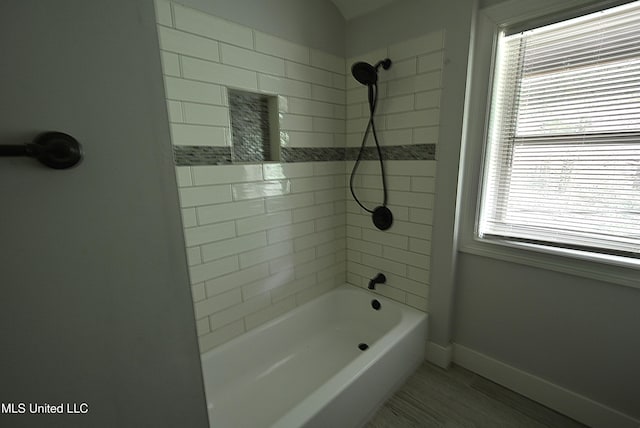 3490 Sherrod Rd, Nesbit, MS 38651 - full bathroom featuring baseboards, wood finished floors, and washtub / shower combination