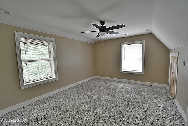 3490 Sherrod Rd, Nesbit, MS 38651 - unfurnished room featuring lofted ceiling, baseboards, ceiling fan, and light carpet