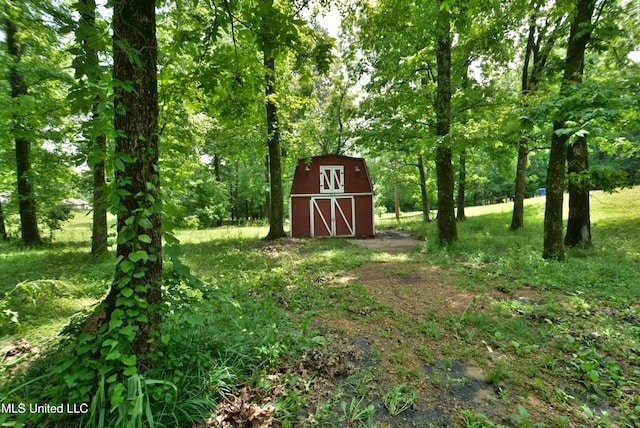 3490 Sherrod Rd, Nesbit, MS 38651 - view of yard with an outdoor structure and a barn