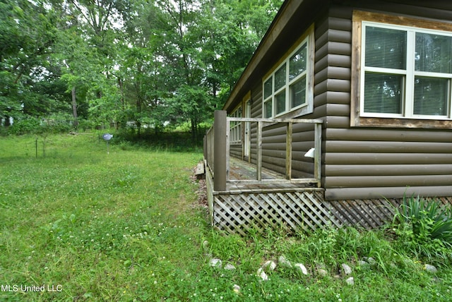 3490 Sherrod Rd, Nesbit, MS 38651 - view of side of property featuring log veneer siding and a lawn