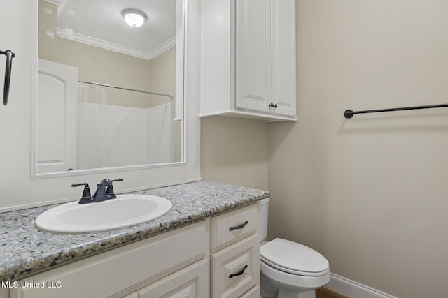 bathroom with ornamental molding, vanity, toilet, and a shower with curtain