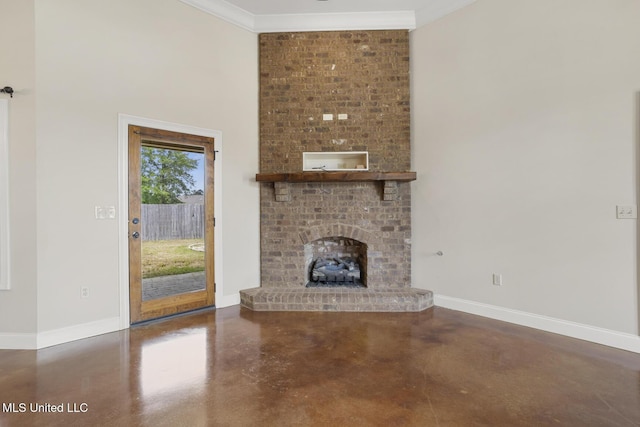 unfurnished living room featuring concrete flooring, baseboards, a fireplace, and ornamental molding