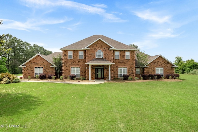 colonial inspired home with a front lawn