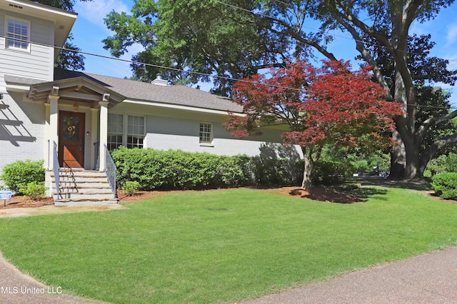 view of front of home with a front yard