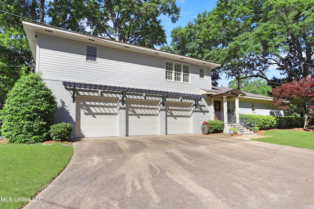 front of property with a garage and a front yard