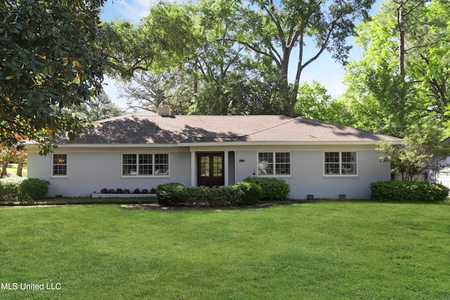 ranch-style house featuring a front yard