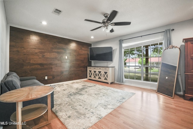 3306 Nottingham Rd, Ocean Springs, MS 39564 - living area with ceiling fan, wood finished floors, recessed lighting, and wood walls