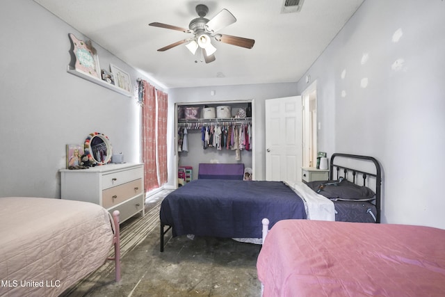 3306 Nottingham Rd, Ocean Springs, MS 39564 - bedroom with concrete flooring, a closet, and ceiling fan