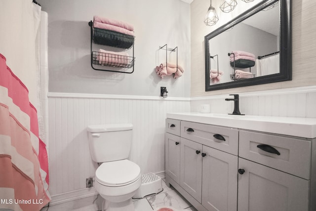 3306 Nottingham Rd, Ocean Springs, MS 39564 - full bathroom with marble finish flooring, vanity, wainscoting, and a shower with curtain