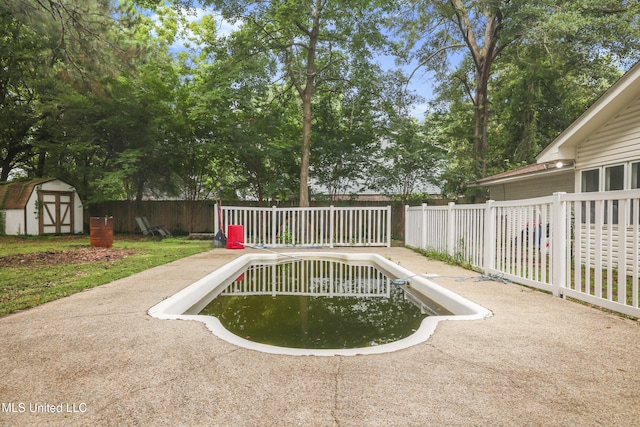 3306 Nottingham Rd, Ocean Springs, MS 39564 - view of pool with a storage unit, a fenced backyard, and a patio