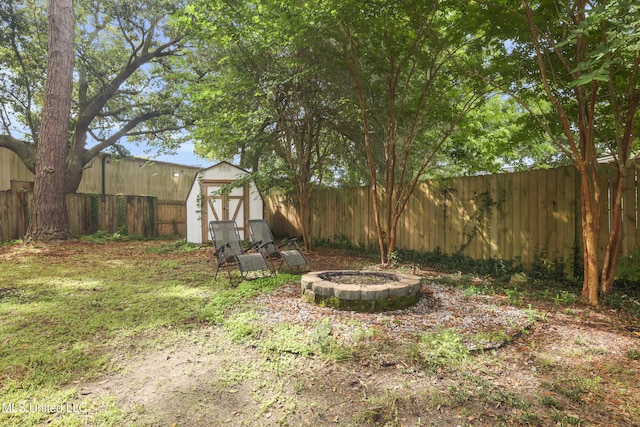 3306 Nottingham Rd, Ocean Springs, MS 39564 - fenced backyard featuring a storage shed and a fire pit