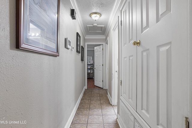 306 Jamaica Dr, Ocean Springs, MS 39564 - hall with a textured ceiling, light tile patterned floors, crown molding, baseboards, and attic access