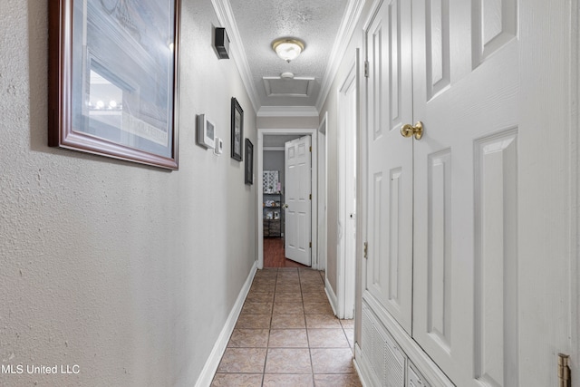 corridor featuring crown molding, light tile patterned flooring, and a textured ceiling