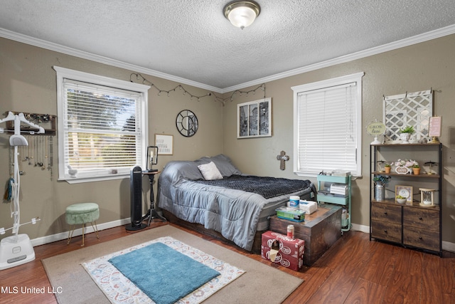 bedroom featuring dark wood-type flooring, crown molding, and a textured ceiling