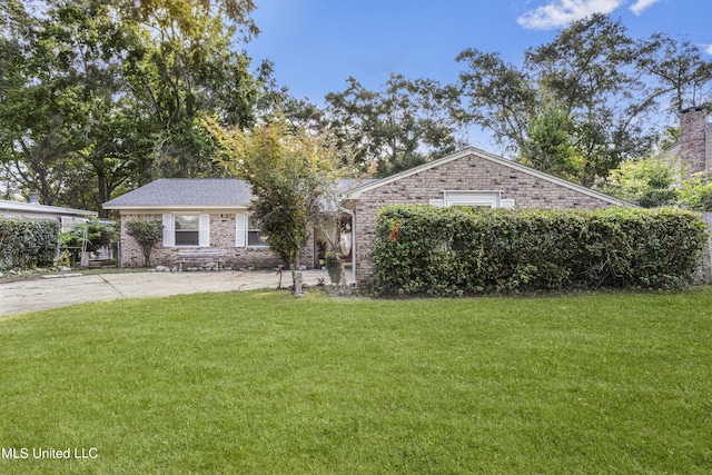 306 Jamaica Dr, Ocean Springs, MS 39564 - ranch-style home featuring brick siding and a front yard