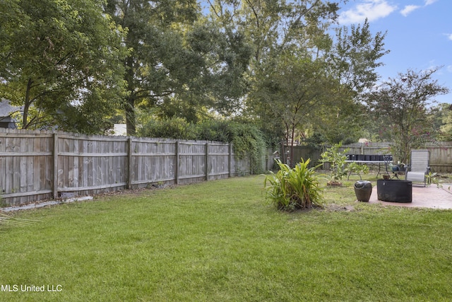 306 Jamaica Dr, Ocean Springs, MS 39564 - view of yard featuring a patio and a fenced backyard