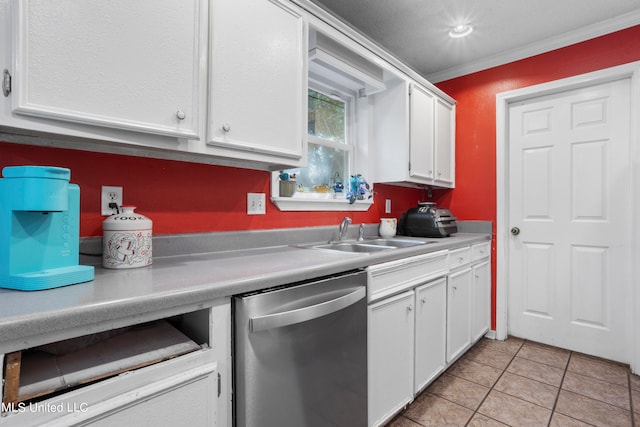 kitchen featuring white cabinetry, stainless steel dishwasher, light tile patterned flooring, crown molding, and sink