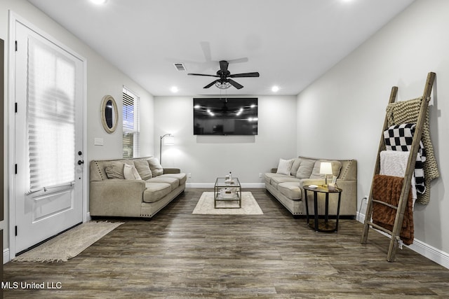 living area featuring recessed lighting, visible vents, baseboards, and wood finished floors