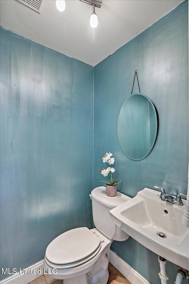 1771 Plantation Blvd, Jackson, MS 39211 - half bath with toilet, a sink, and visible vents