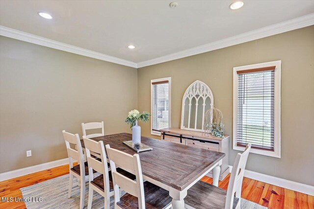 1771 Plantation Blvd, Jackson, MS 39211 - dining area with light wood-type flooring, plenty of natural light, baseboards, and ornamental molding
