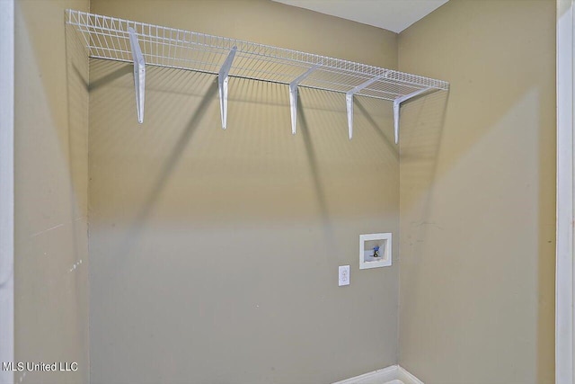 1771 Plantation Blvd, Jackson, MS 39211 - clothes washing area featuring baseboards, hookup for a washing machine, and laundry area