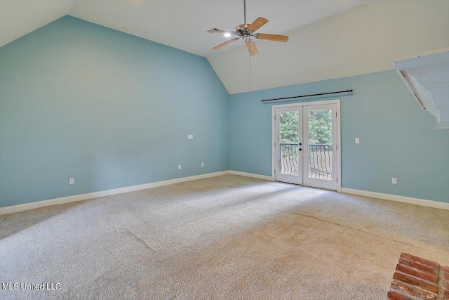 interior space featuring lofted ceiling, carpet, french doors, and ceiling fan