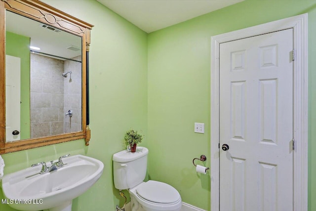 1771 Plantation Blvd, Jackson, MS 39211 - bathroom featuring toilet, a sink, and baseboards
