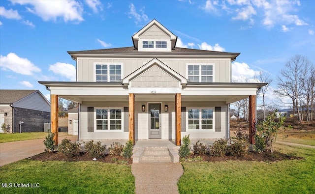 view of front of property featuring a front lawn and covered porch