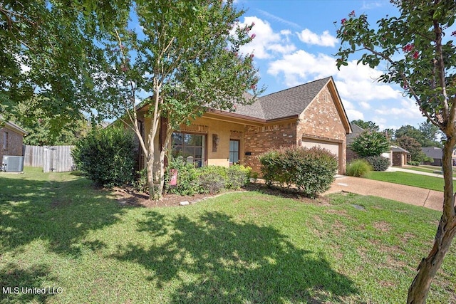 single story home featuring a garage, a front lawn, and central AC unit