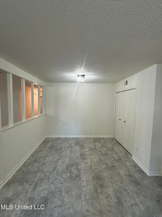 interior space with a textured ceiling