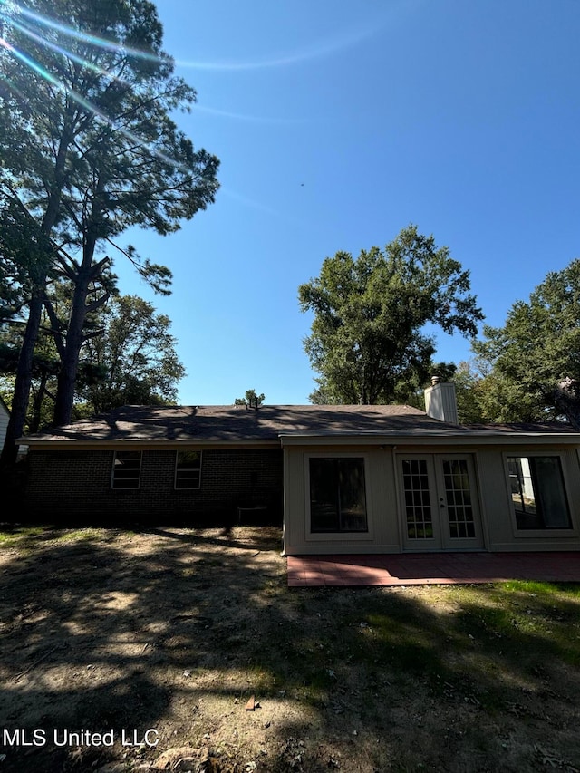 back of house featuring french doors