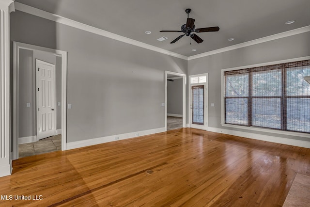 empty room with ceiling fan, light hardwood / wood-style flooring, and ornamental molding