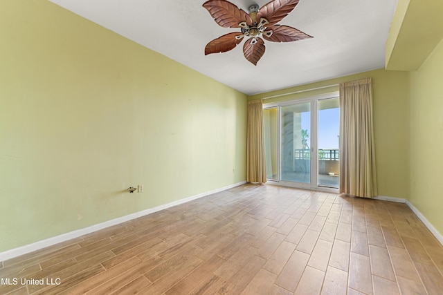2230 Beach Dr Unit 205, Gulfport, MS 39507 - empty room with a ceiling fan, light wood-type flooring, and baseboards