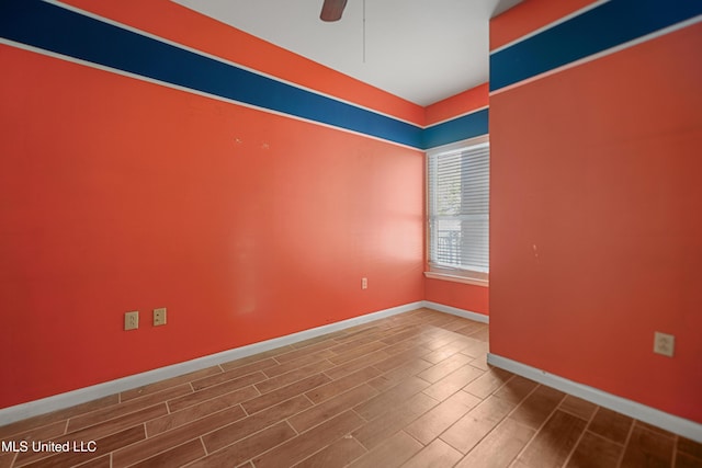 2230 Beach Dr Unit 205, Gulfport, MS 39507 - spare room with wood finished floors, a ceiling fan, and baseboards
