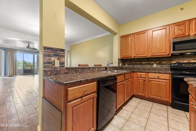 2230 Beach Dr Unit 205, Gulfport, MS 39507 - kitchen featuring black appliances, a sink, tasteful backsplash, and crown molding