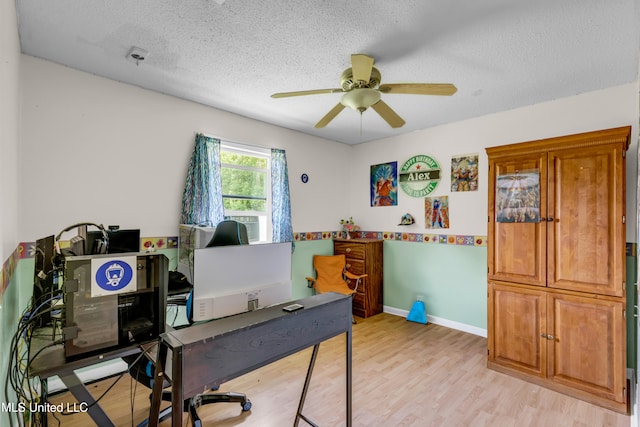 5608 Claresholm Dr, Gautier, MS 39553 - office featuring a ceiling fan, a textured ceiling, light wood finished floors, and baseboards
