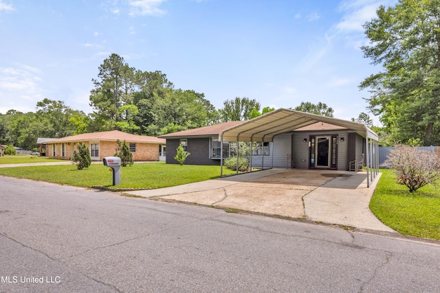 5608 Claresholm Dr, Gautier, MS 39553 - ranch-style house featuring concrete driveway and a carport