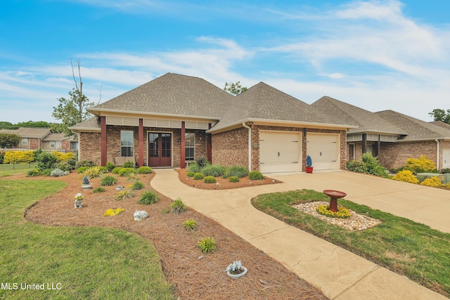 35 Enclave Cir, Ridgeland, MS 39157 - view of front facade featuring brick siding, a garage, a shingled roof, concrete driveway, and a front yard